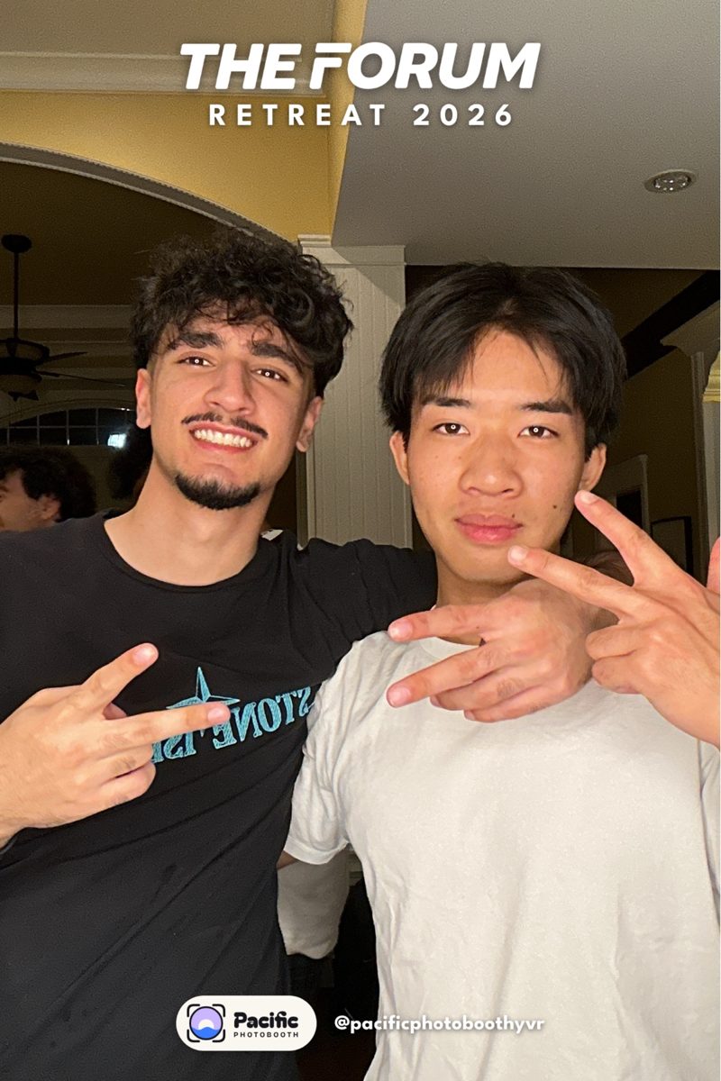 Two friends posing at the Pacific Photobooth at The Forum Retreat 2026